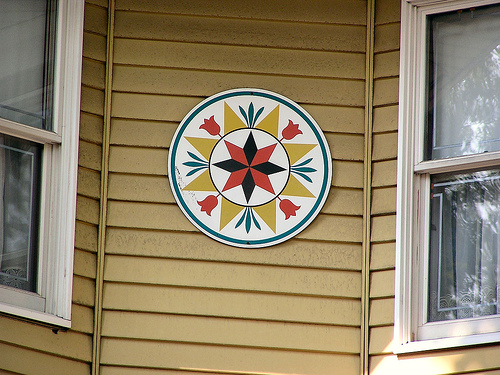 Pennsylvania Dutch hex sign on house.