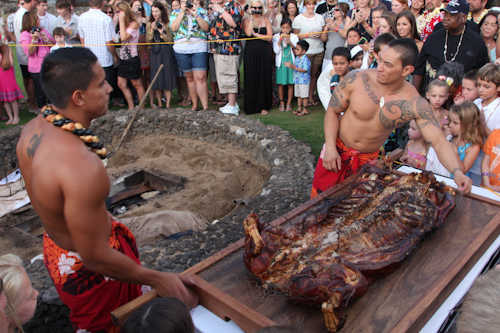 Pulling out the kalua pig. jpg