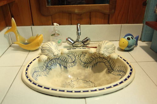 The bathroom sink had built in otters. jpg