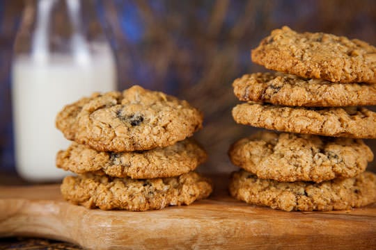 A stack of chewy oatmeal cookies with dried blueberries and crystallized ginger. Photo and recipe by Irvin Lin. www.eatthelove.com 