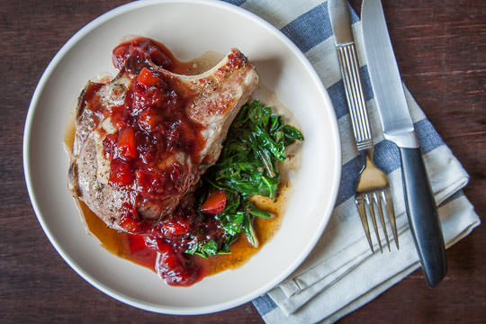 Stuffed Pork Chop with Chard, Cherries and a Plum Balsamic Reduction Glaze. Recipe and Photo by Irvin Lin of Eat the Love. 