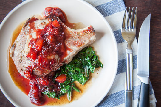 Stuffed Pork Chop Recipe with Chard, Cherries and a Plum Balsamic Reduction Glaze. Recipe and Photo by Irvin Lin of Eat the Love. 