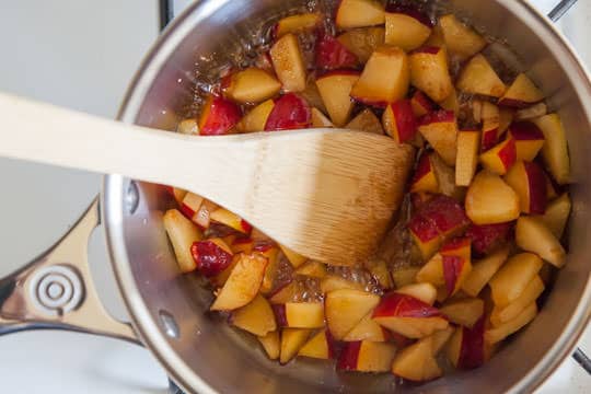 Make the plum balsamic reduction glaze by cooking the chopped plums first in the pan. Process photo by Irvin Lin of Eat the Love.
