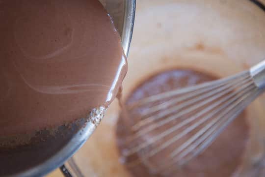 Pour a little bit of the hot chocolate cream into the egg yolk paste. Photo by Irvin Lin of Eat the Love.