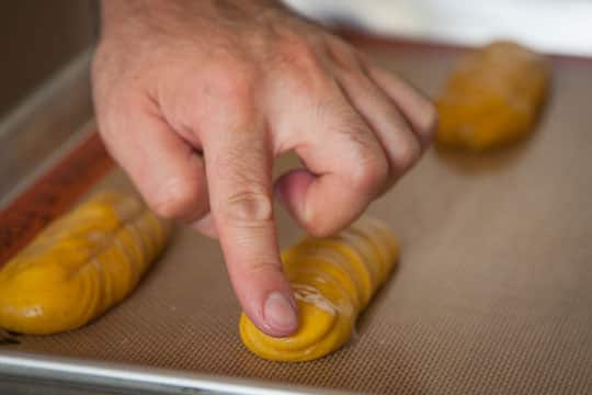 Wet your fingers and pat down and point tips of the dough. Photo by Irvin Lin of Eat the Love. 