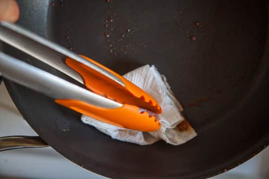 Wipe up pan with a paper towel using tongs. Process photos by Irvin Lin of Eat the Love.