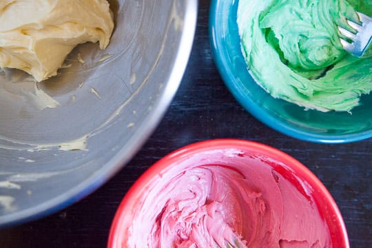 Divide the cheesecake batter into three bowls and color the two of them with red and green food coloring. Photo by Irvin Lin of Eat the Love.