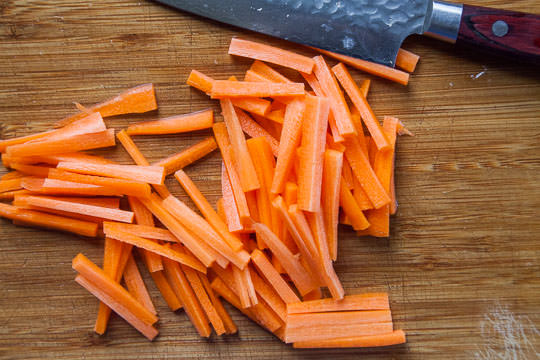 Cut the carrots into matchsticks for the Korean japchae. Photo by Irvin Lin of Eat the Love.