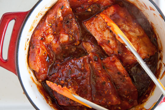 Toss and turn the ribs in the sauce. Photo by Irvin Lin of Eat the Love.
