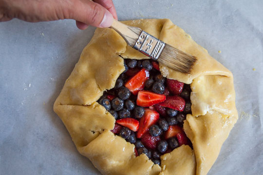 Brush the top of the crust with the egg wash. Process photo by Irvin Lin of Eat the Love.