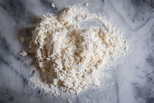 Dump the dry and crumbly dough onto a clean surface dusted with flour. Photo by Irvin Lin of Eat the Love.