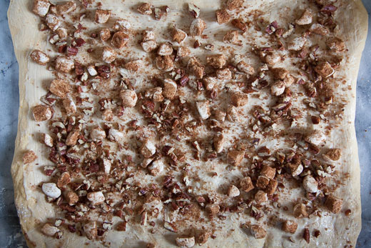 Sprinkle the brown sugar and spices, pecans and marshmallows over the buttery dough. Process photo by Irvin Lin of Eat the Love.