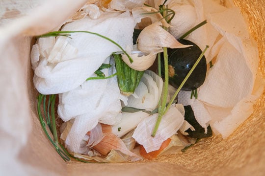 Just toss your kitchen scraps into the brown bag! Photo and tip by Irvin Lin of Eat the Love.