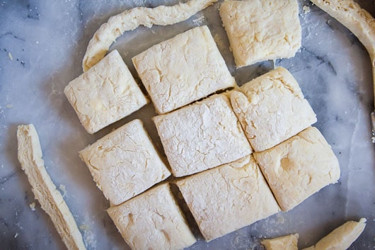 Cut the dough into 9 squares. 