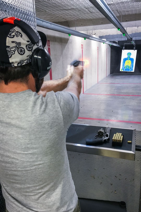 AJ firing a gun. 