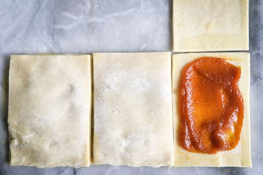 Cover the pumpkin butter rectangles with the untouched pastry rectangles.