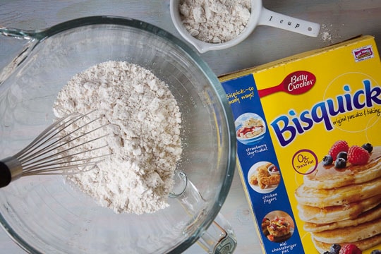 Add Bisquick and stir with balloon whisk.