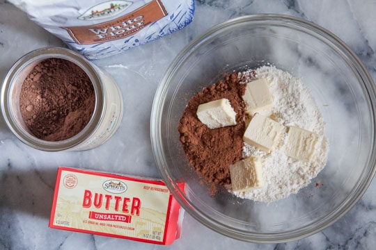 Place the dry ingredients for the crust in the bowl then add the cold butter.