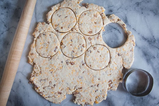 Roll out the dough and cut out the biscuits with a 3-inch round cutter.