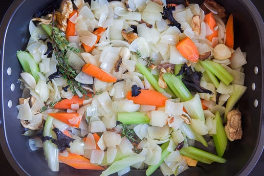 move the vegetables to a roasting pan and spread evenly on the bottom.
