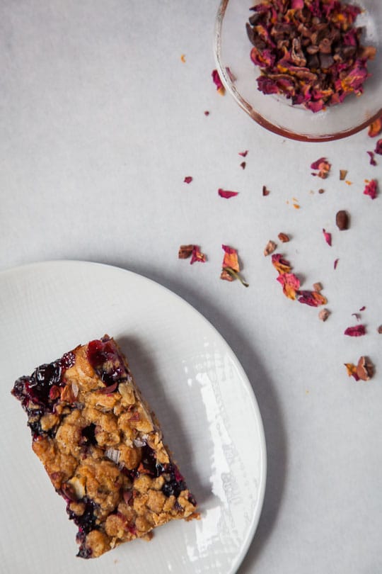 Rhubarb & Blueberry Oatmeal Bars with Cacao Nibs and Rose Petals. Recipe and photo by Irvin Lin of Eat the Love.