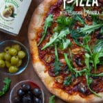Double Olive Pizza with Sausage and Arugula.