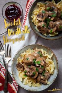Swedish Meatball Stroganoff served in two bowls with side bowl of lingonberry sauce.
