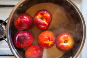 quickly cook the peaches in the hot water