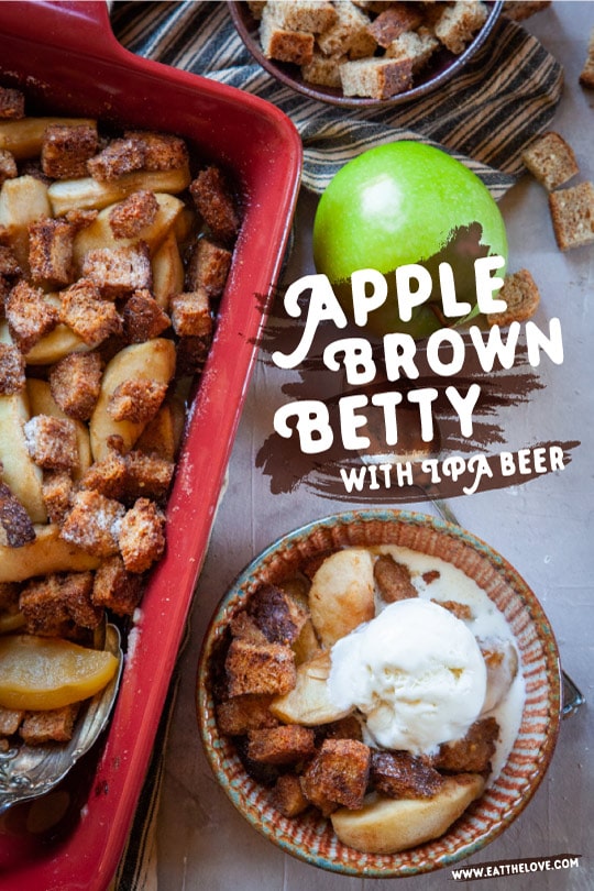 Apple Brown Betty Dessert on a table, served with a scoop of vanilla ice cream.