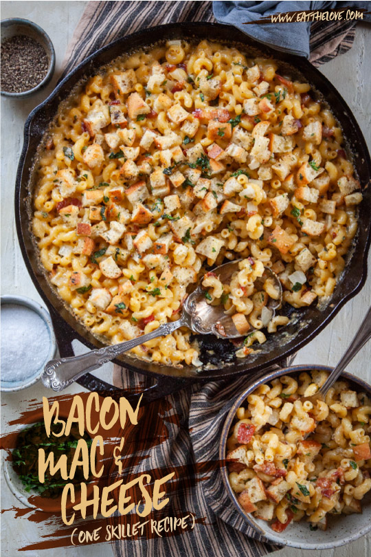 Bacon Mac and Cheese in a cast iron skillet on a table.