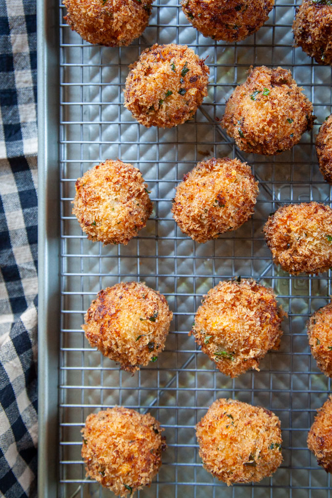 Fried Mac and Cheese Balls on a wire rack.