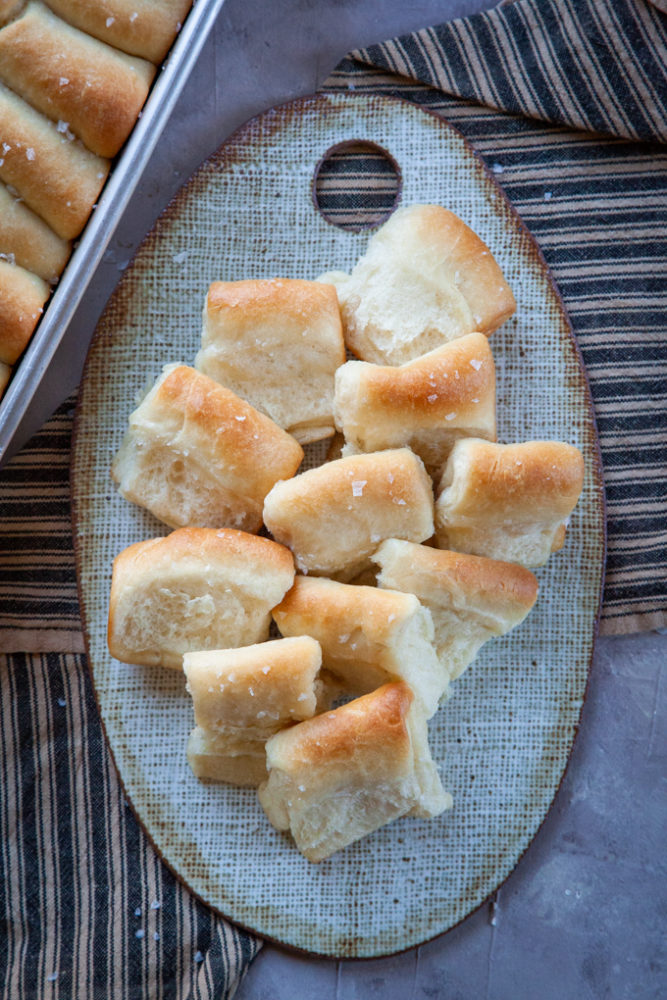 Parker House Rolls on a serving plate.