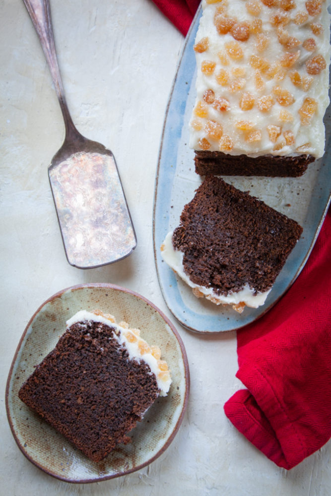 Sliced gingerbread stout cake on a plate.