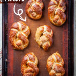 Just baked soft beer pretzel twists on a baking pan.