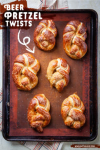 Just baked soft beer pretzel twists on a baking pan.