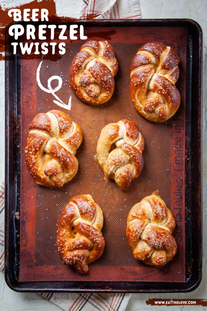 Just baked soft beer pretzel twists on a baking pan.