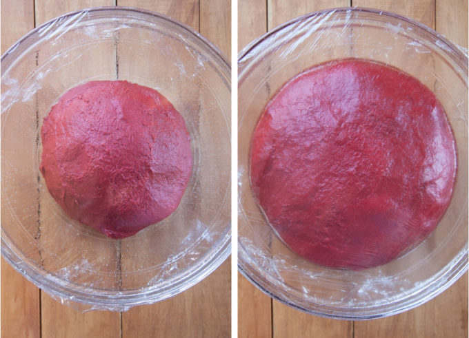 Red velvet cinnamon roll dough rising and doubling in size.