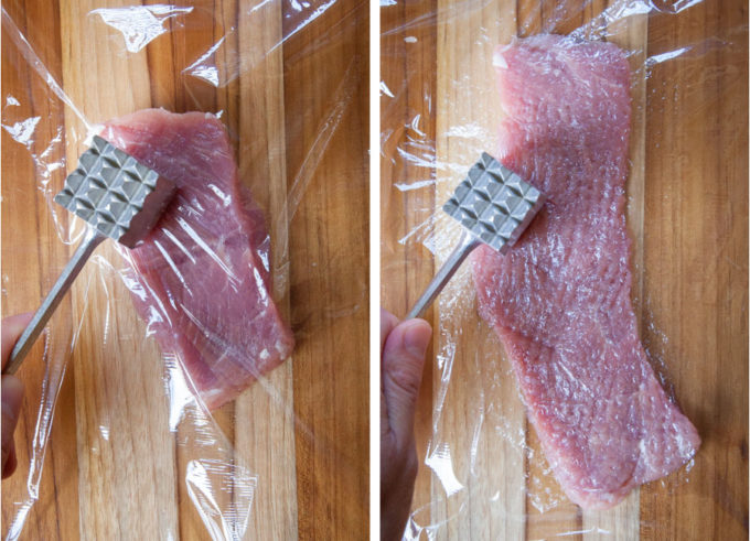 a kitchen mallet flattening a piece of pork tenderloin