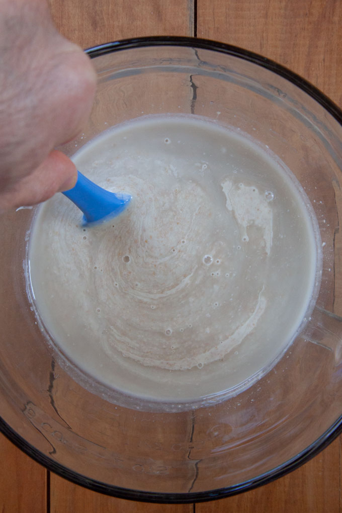 Liquidy sourdough discard being stirred