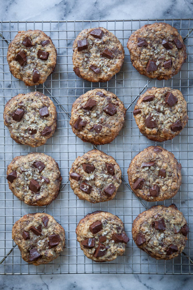 sourdough chocolate chunk cookies cooling on a wire rack.