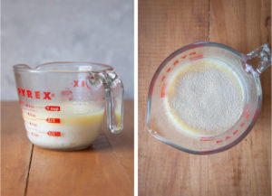 Melted butter combined with milk in a glass measuring cup.
