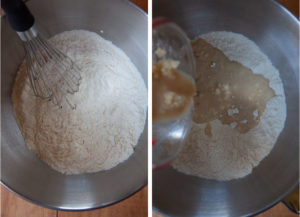 Flour and sugar in the bowl of stand mixer, with the liquid being added to it.