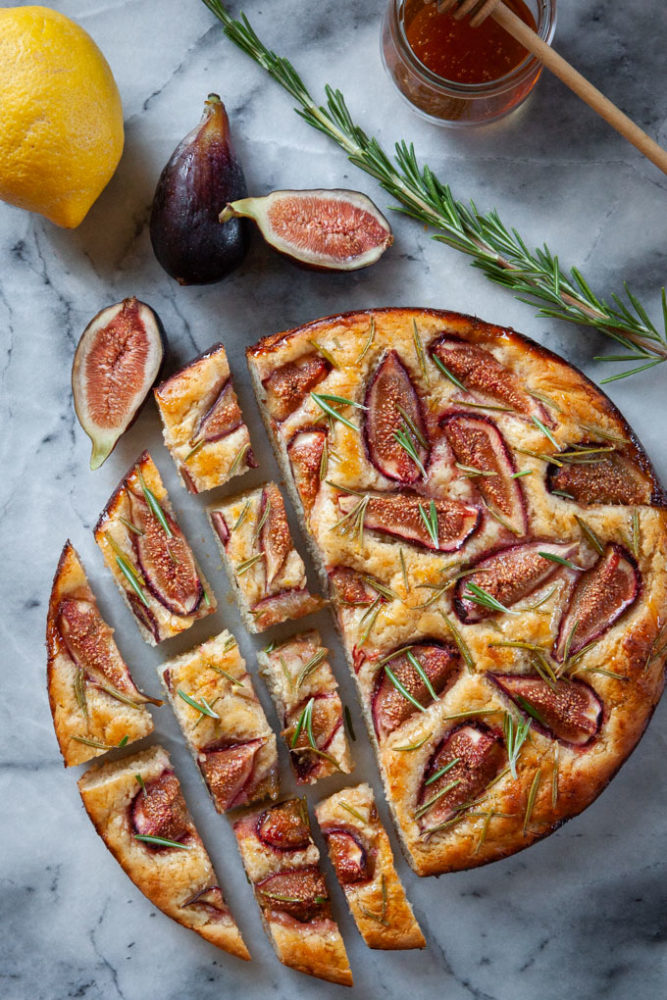 Fig focaccia cut on a marble surface.