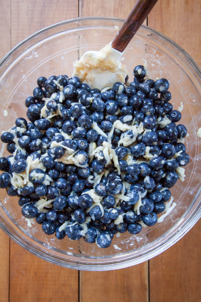 A bowl with ingredients for a blueberry pie filling.