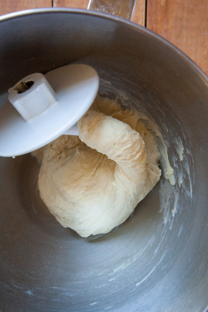 Focaccia bread dough kneaded with a dough hook.