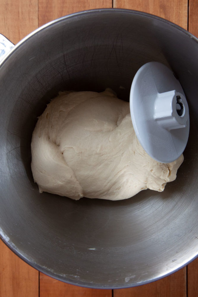 pretzel dough smooth and elastic after being kneaded by the dough hook in the bowl of a stand mixer.