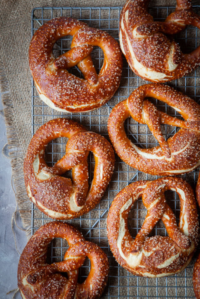 Traditional Bavarian pretzels on a wire rack.