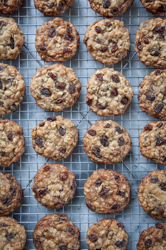 Oatmeal raisin cookies on a wire cooling rack.