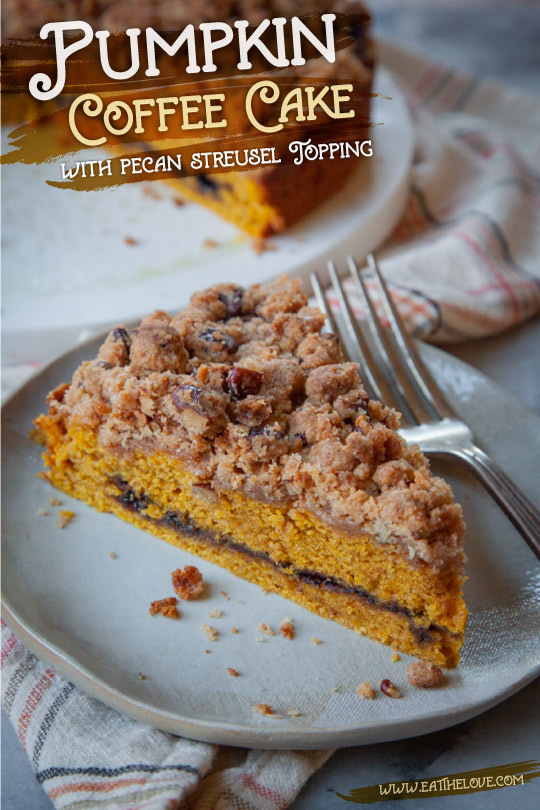 a slice of pumpkin coffee cake on a plate, with the remaining cake behind it.