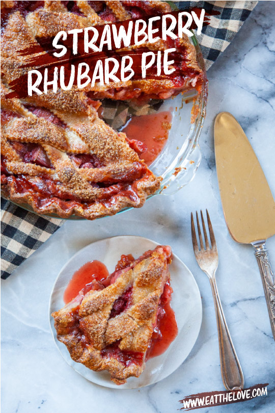 A slice of strawberry rhubarb pie cut out and sitting on a plate with the remaining pie in a pie pan next to it.